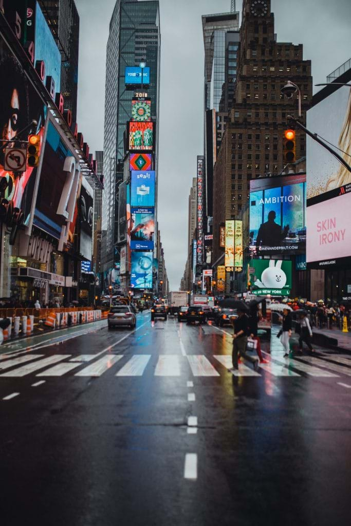 man-crossing-on-pedestrian-lane-at-time-square-new-york-1705073-683×1024