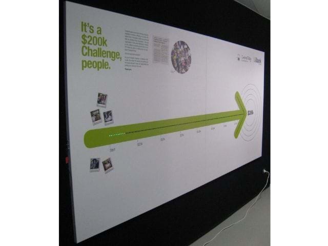 Display banner with user-controlled LED lighting bulbs allows you to track progress towards a target. - Displays2Go