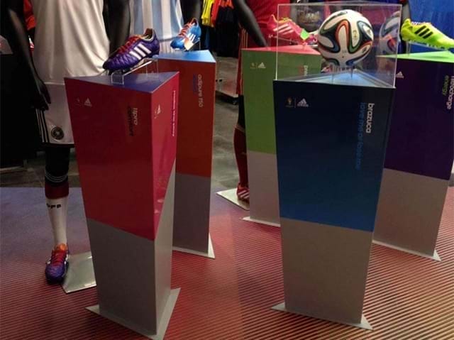 Customised triangular stands for sports store display - Displays2Go